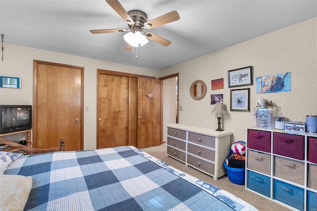 bedroom with light carpet and ceiling fan