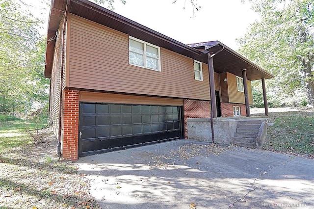 view of side of property featuring a garage