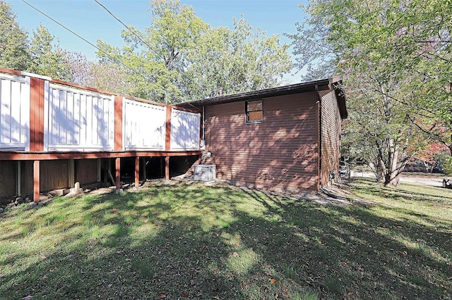 back of house with a lawn