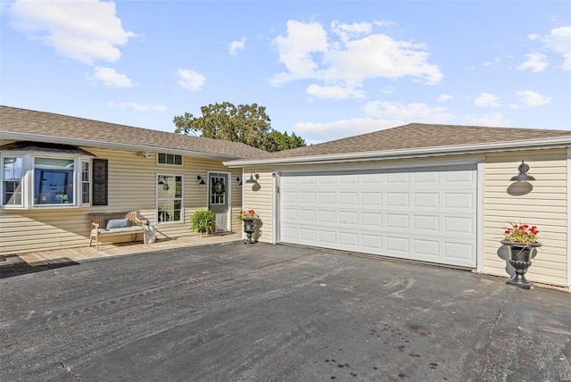 ranch-style home with a garage