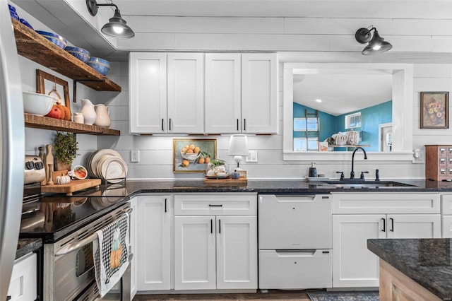 kitchen featuring tasteful backsplash, white dishwasher, electric stove, sink, and white cabinets