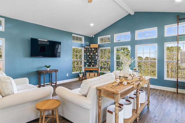 living room with vaulted ceiling with beams, dark hardwood / wood-style floors, and a healthy amount of sunlight