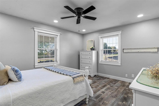 bedroom with ceiling fan and dark hardwood / wood-style flooring