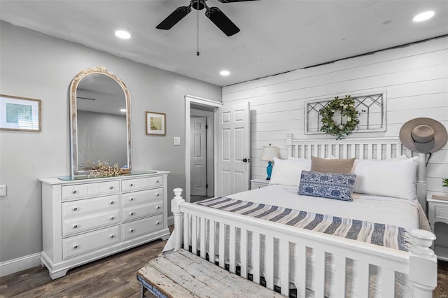 bedroom with ceiling fan and dark wood-type flooring