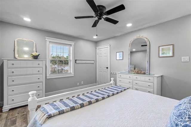 bedroom featuring ceiling fan and dark hardwood / wood-style flooring