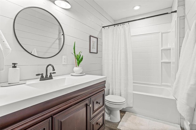 full bathroom featuring vanity, toilet, and shower / tub combo with curtain