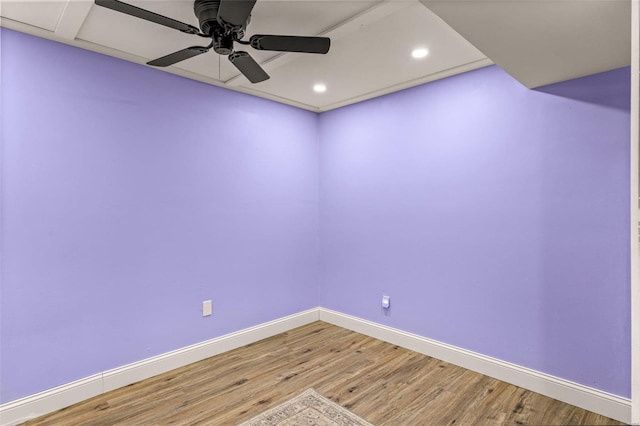 empty room featuring ceiling fan and wood-type flooring