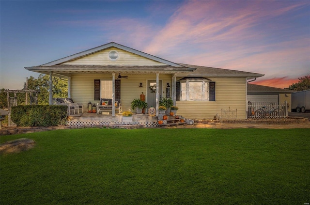 view of front of home featuring a lawn and covered porch