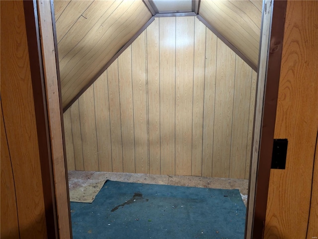 interior space with wood ceiling and wood walls