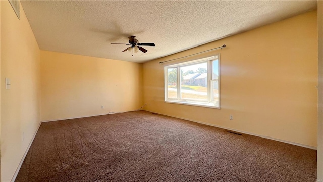 unfurnished room featuring carpet, a textured ceiling, and ceiling fan