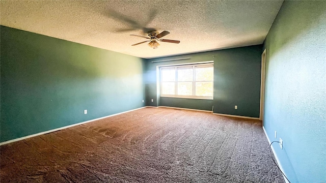 carpeted spare room with ceiling fan and a textured ceiling