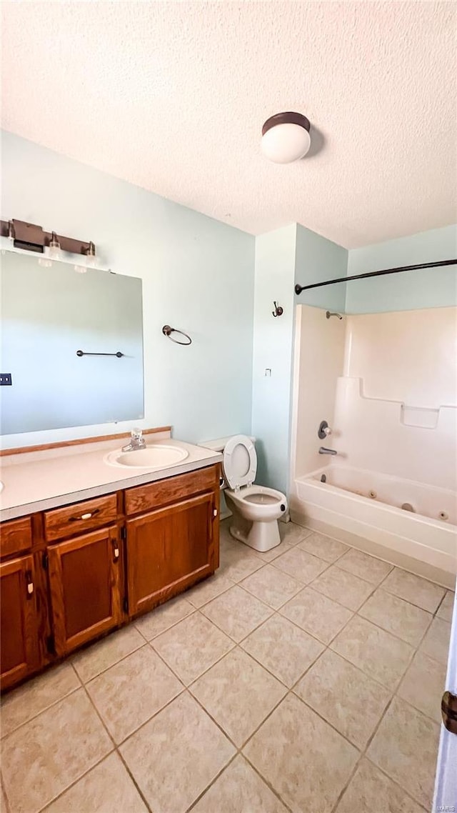 full bathroom featuring a textured ceiling, toilet, vanity, bathing tub / shower combination, and tile patterned flooring