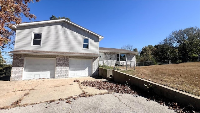 view of side of home featuring a garage