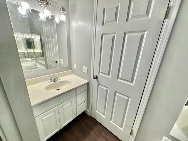 bathroom featuring vanity and hardwood / wood-style flooring