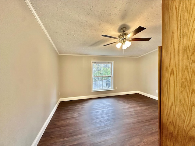 spare room with ornamental molding, ceiling fan, a textured ceiling, and dark hardwood / wood-style flooring