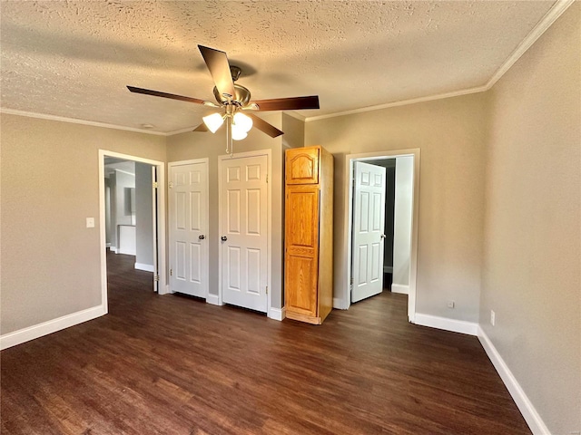 unfurnished bedroom featuring ornamental molding, a textured ceiling, dark hardwood / wood-style floors, and ceiling fan