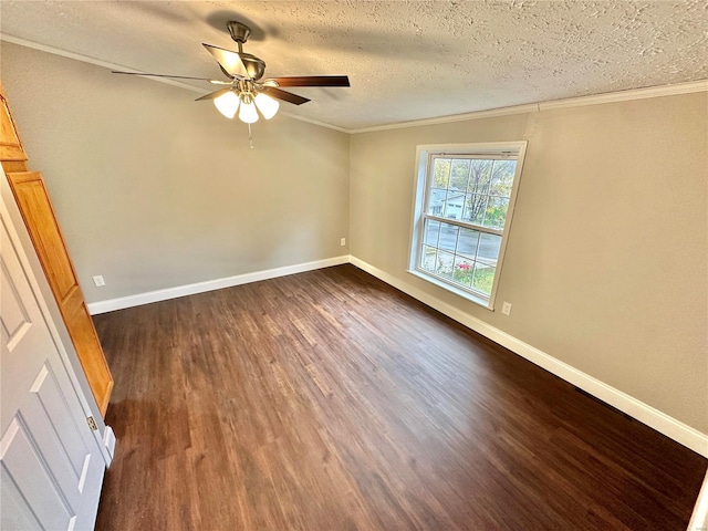 spare room with ornamental molding, dark wood-type flooring, a textured ceiling, and ceiling fan