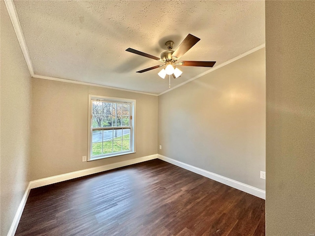 spare room with ceiling fan, a textured ceiling, ornamental molding, and dark hardwood / wood-style floors