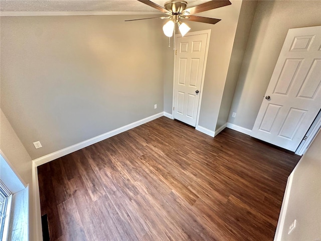 unfurnished bedroom featuring ornamental molding, dark hardwood / wood-style floors, a textured ceiling, and ceiling fan