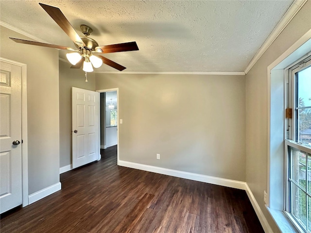 unfurnished room with dark hardwood / wood-style floors, a healthy amount of sunlight, a textured ceiling, and ceiling fan