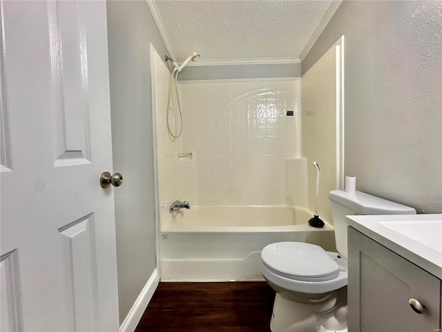 full bathroom with shower / tub combination, a textured ceiling, hardwood / wood-style flooring, toilet, and vanity