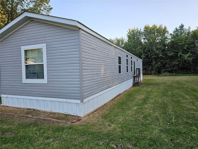 view of home's exterior featuring a yard