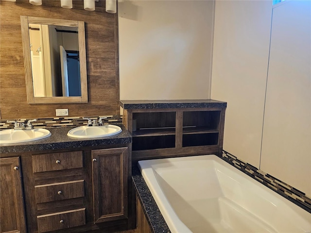 bathroom with a bathing tub and vanity