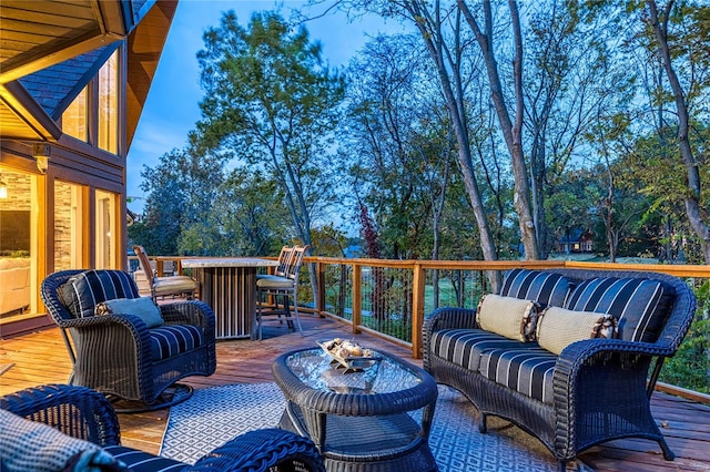 wooden terrace featuring outdoor lounge area