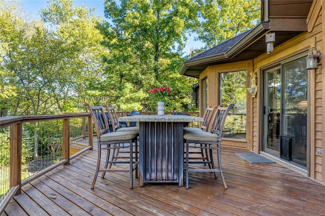 wooden terrace featuring a bar