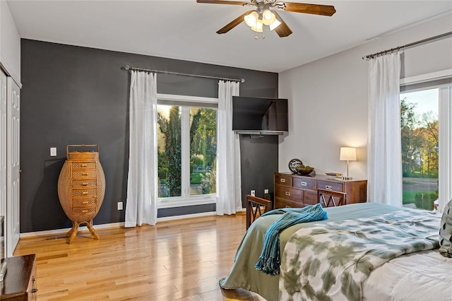 bedroom featuring ceiling fan and light hardwood / wood-style floors