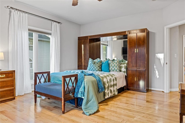 bedroom with ceiling fan, light hardwood / wood-style floors, and access to outside