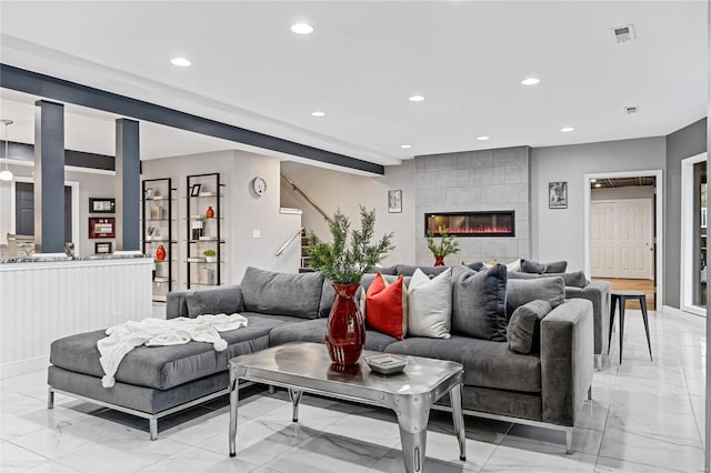 living room featuring a fireplace