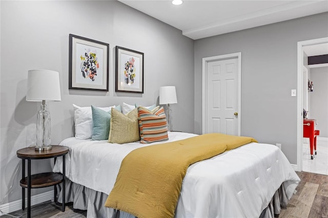 bedroom with hardwood / wood-style floors