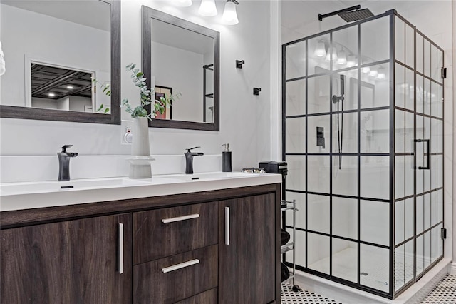 bathroom with vanity and a tile shower