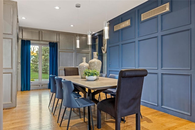 dining room with light hardwood / wood-style flooring