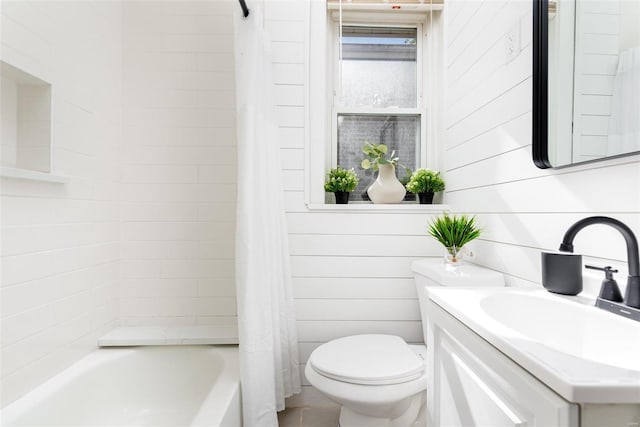 full bathroom featuring vanity, toilet, shower / bath combination with curtain, and wooden walls