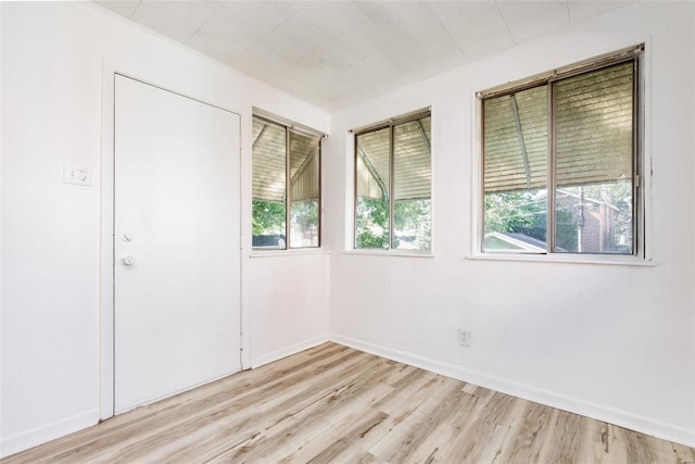 spare room with light hardwood / wood-style flooring