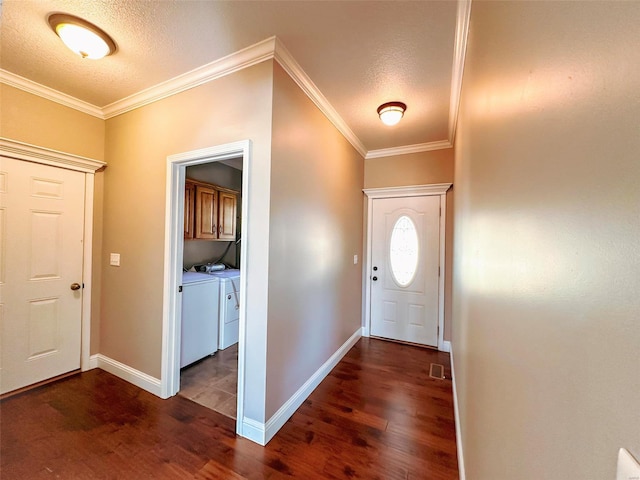 entryway with washer and dryer, ornamental molding, a textured ceiling, and dark hardwood / wood-style floors