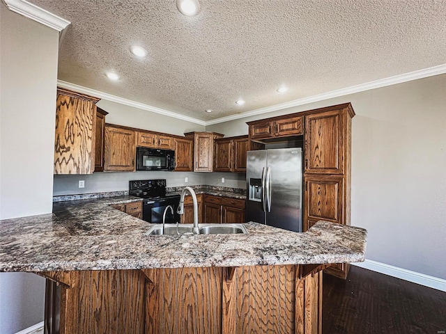 kitchen featuring kitchen peninsula, dark hardwood / wood-style floors, black appliances, crown molding, and sink