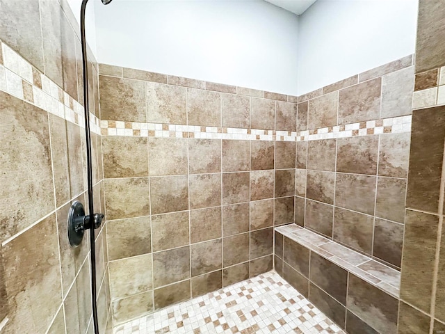 bathroom with a tile shower