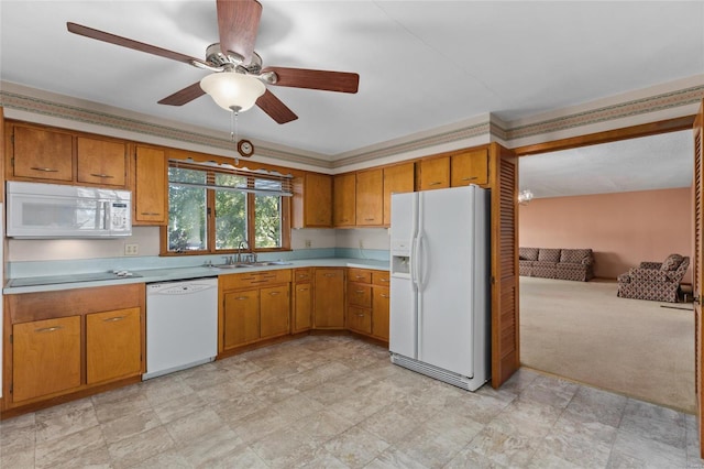 kitchen featuring ceiling fan, sink, crown molding, light colored carpet, and white appliances