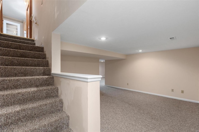 staircase with carpet floors