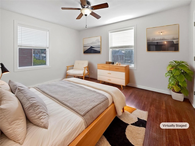 bedroom featuring ceiling fan and dark hardwood / wood-style floors