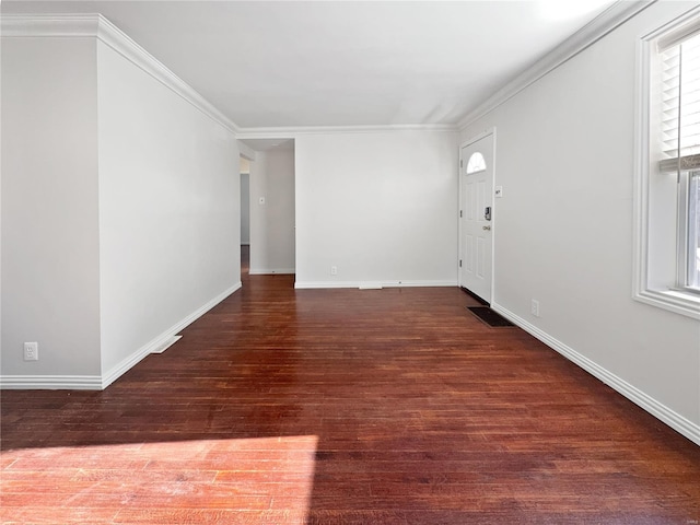 foyer featuring ornamental molding and dark hardwood / wood-style flooring