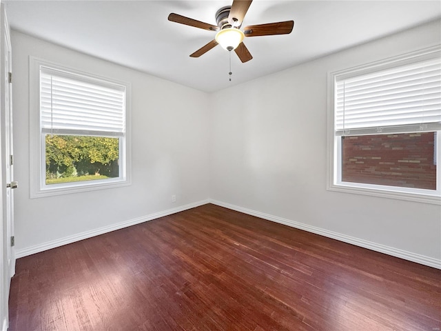 empty room featuring dark hardwood / wood-style floors and ceiling fan