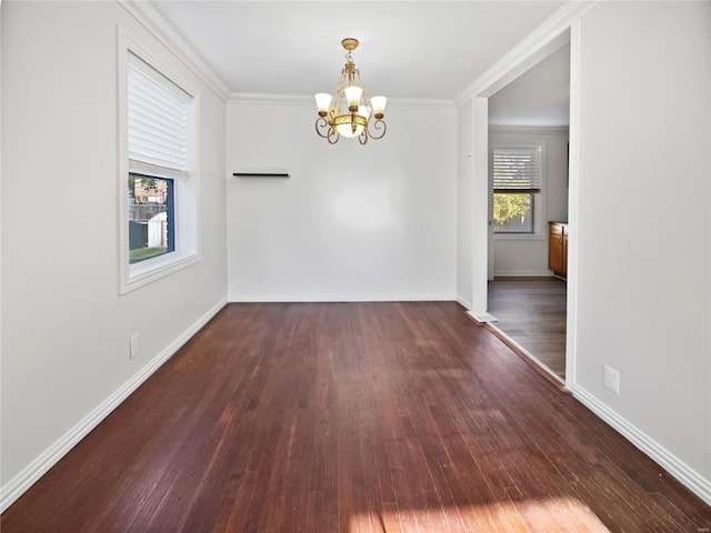 unfurnished dining area featuring ornamental molding, an inviting chandelier, and dark hardwood / wood-style floors