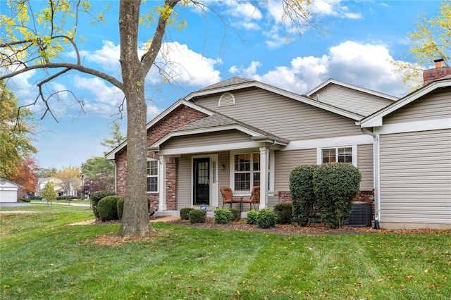 view of front of house featuring cooling unit, covered porch, and a front yard