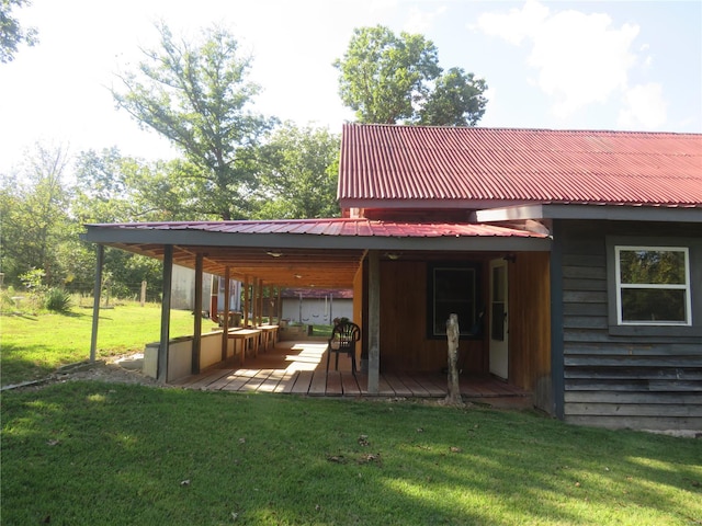 back of property featuring a yard and a deck