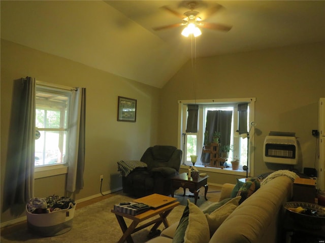 living room with ceiling fan, lofted ceiling, and heating unit