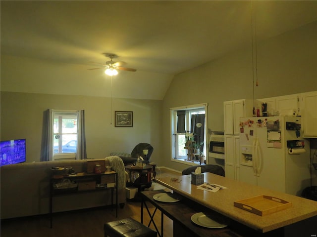 dining area with ceiling fan and lofted ceiling